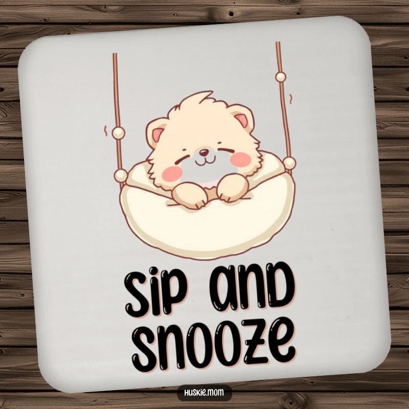 Funny Coaster: A fluffy animal with a playful grin sleeping soundly in a suspended bed, offering peaceful surface protection.