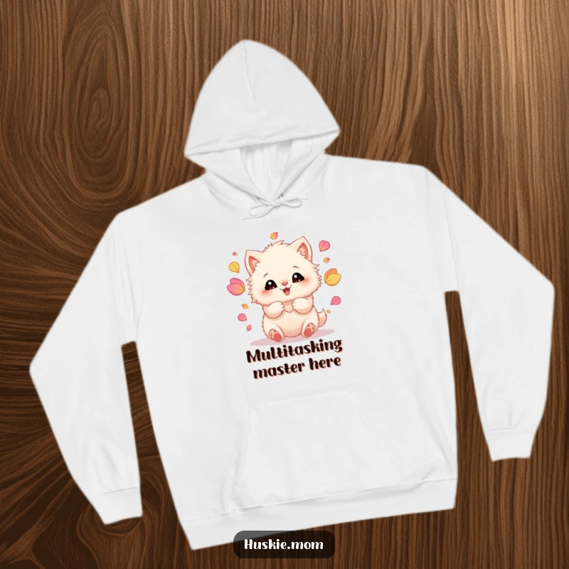 Funny hoodie featuring a fluffy animal with ecstatic eyes, skillfully juggling a cascade of colorful petals with its paws.