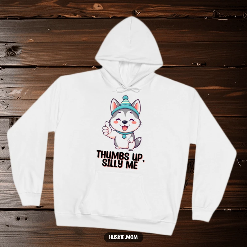 Funny Kawaii Husky Hoodie: A depiction of an ultra-cute Husky in a comical hat, giving a confident thumbs up, radiating joy.