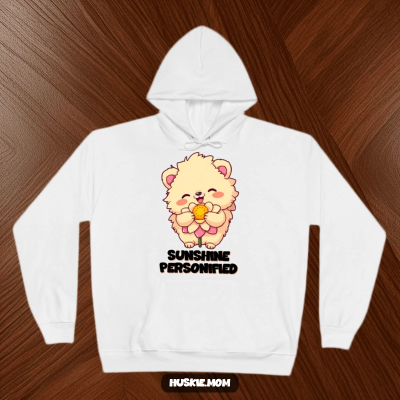 Funny Hoodie featuring a fluffy animal with a sunny disposition embracing a colorful bloom, radiating warmth and humor.