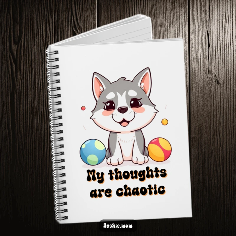 Funny notebook with a silly husky dog attempting to juggle three colorful balls, ideal for jotting down notes and creative ideas.
