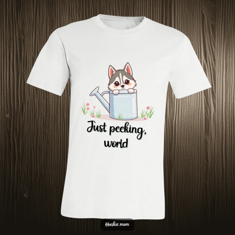 Funny Husky Lady T-Shirt, mischievously peeking from behind a massive watering can, a whimsical garden-themed graphic for humor.
