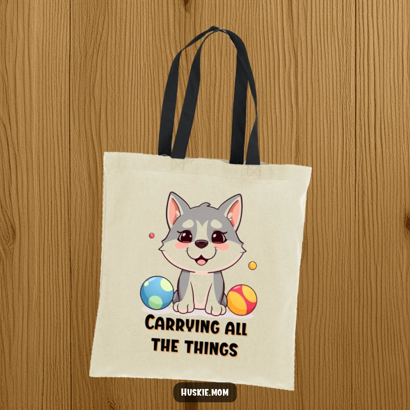 Funny tote bag with a silly husky dog trying to juggle three colorful balls, symbolizing playful chaos and determination.